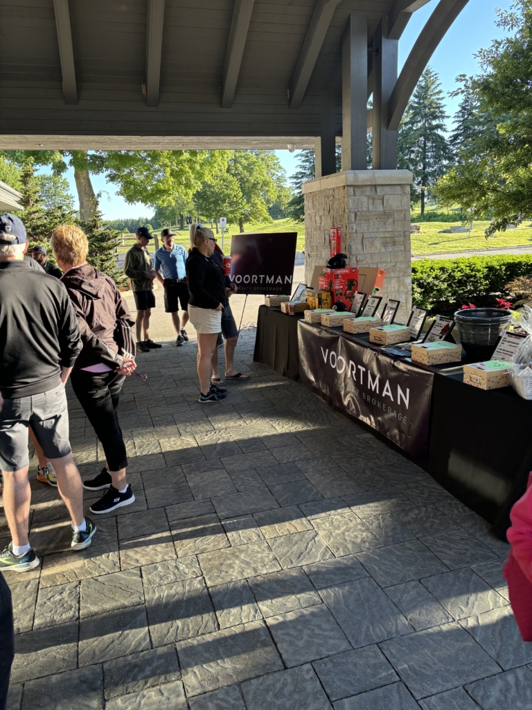 Golf tournament participants view the prize tables